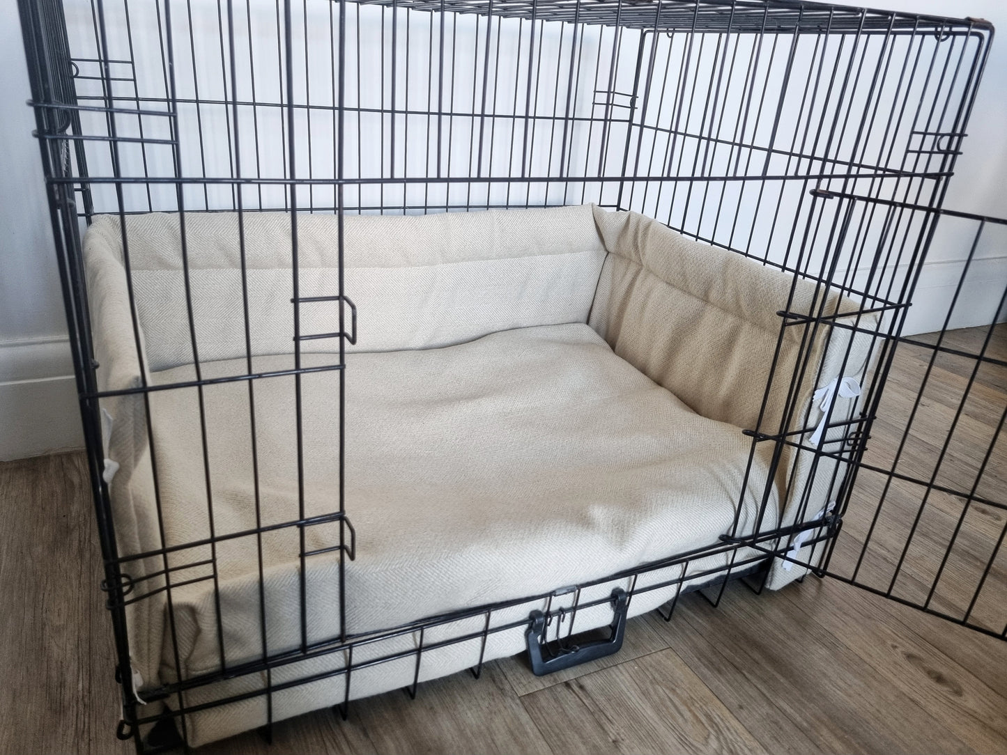 Dog crate bumper and bed - dog crate bedding. Cream herringbone dog crate bumper pads attaching to metal dog crate to support with puppy training and dog crate training.