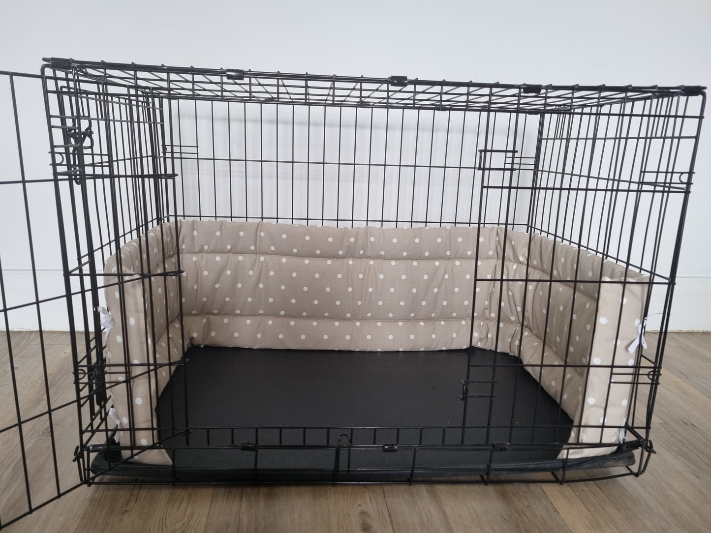 Dog crate bumper and bed - dog crate bedding. Taupe spotty design crate bumper pads attaching to metal dog crate to support with puppy training and dog crate training.