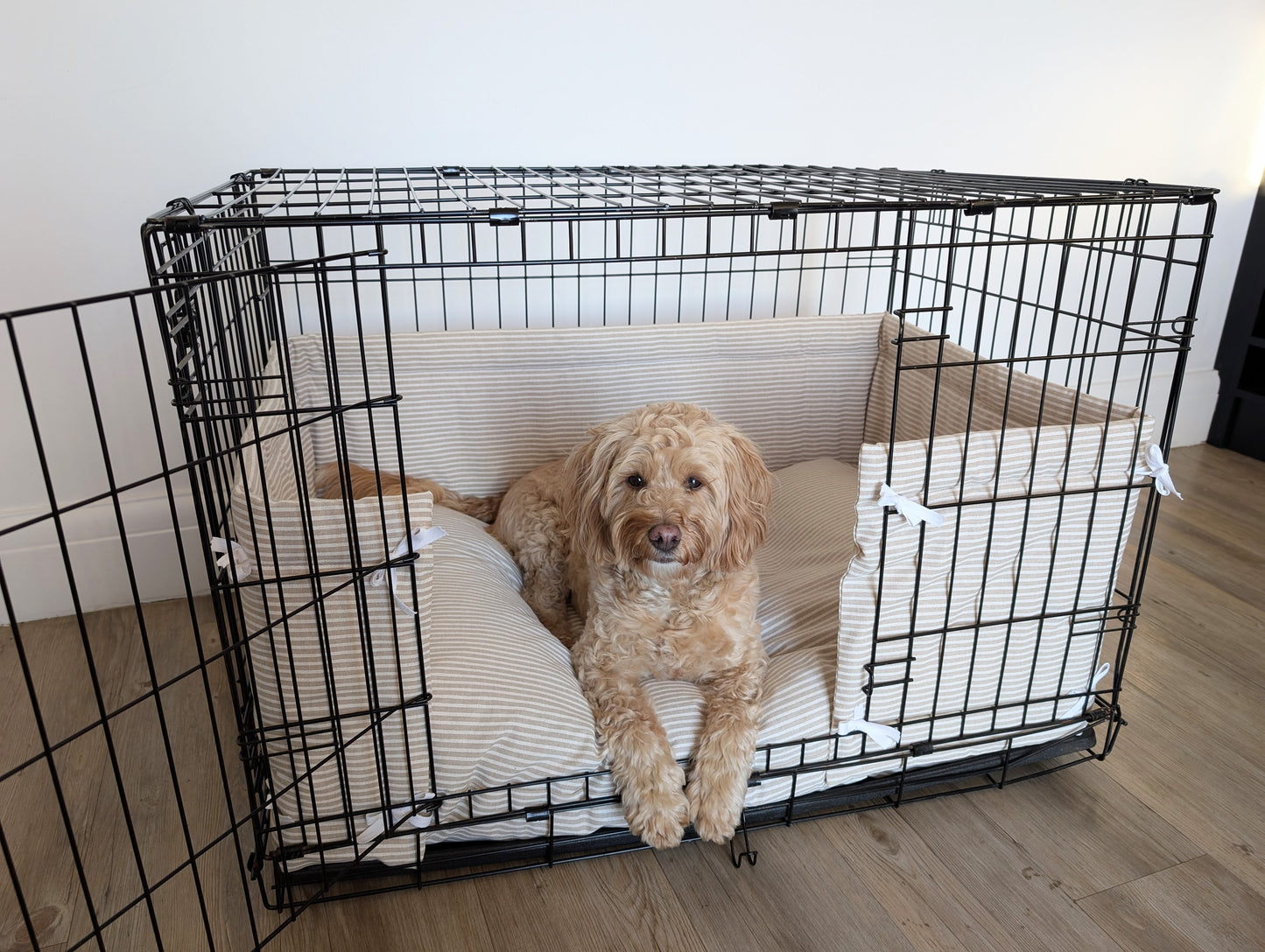 Dog crate bumper and bed - dog crate bedding. Beige white striped dog crate bumper pads attaching to metal dog crate to support with puppy training and dog crate training.