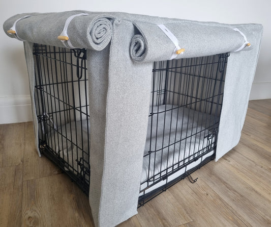 Stylish fabric dog crate cover. The custom kennel cover features a grey-toned, aesthetic design with a herringbone pattern, offering a cosy and decorative touch to the pet's space.