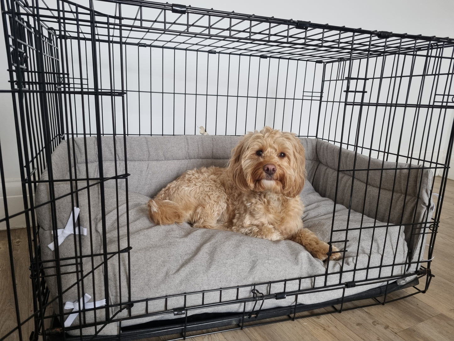 Dog crate bumper and bed - dog crate bedding. Grey linen-look cotton dog crate bumper pads attaching to metal dog crate to support with puppy training and dog crate training.  Featuring custom dog crate mattress.