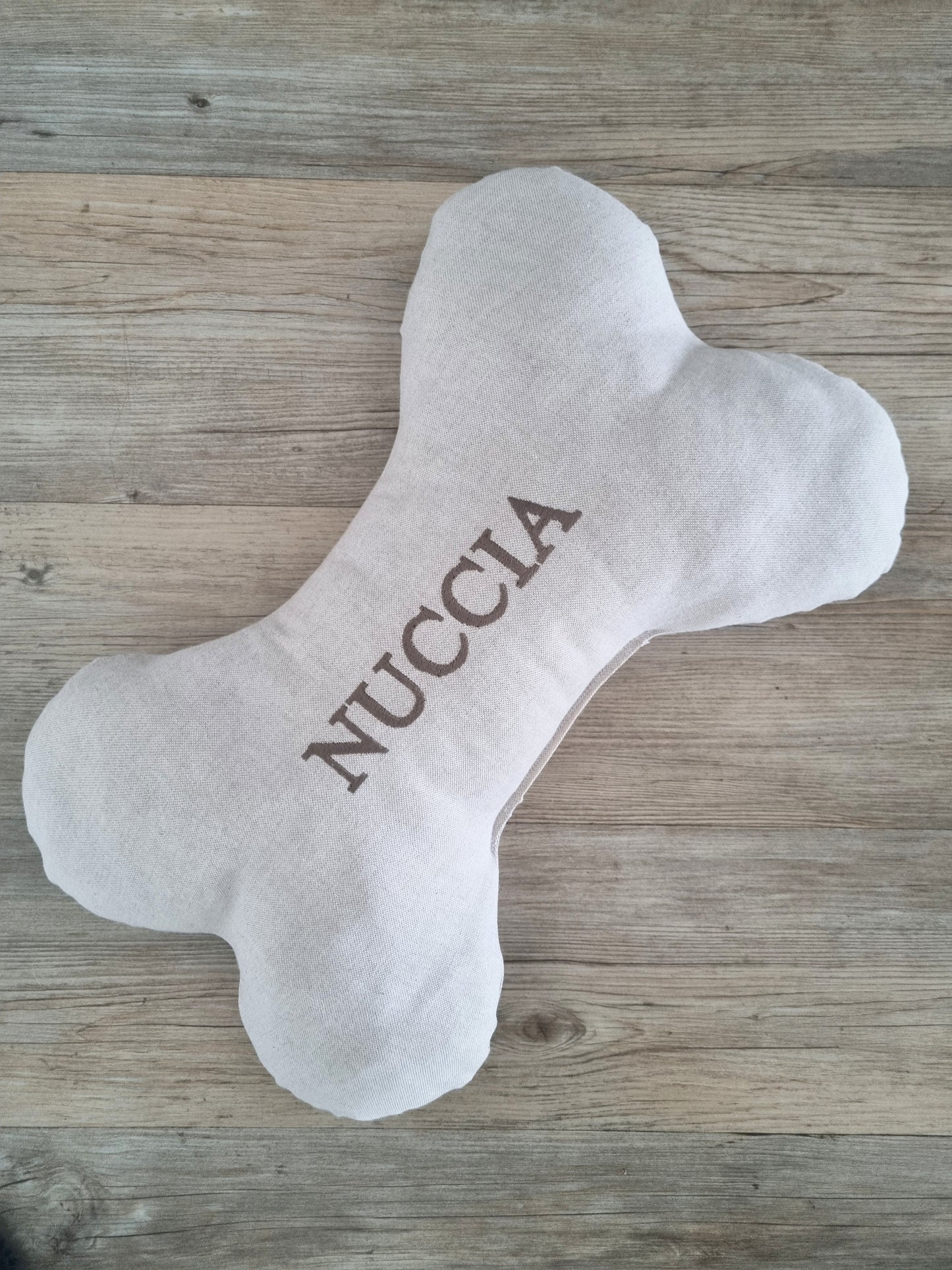 Personalised dog bone-shaped pillow. A neutral custom gift for dogs and puppies.