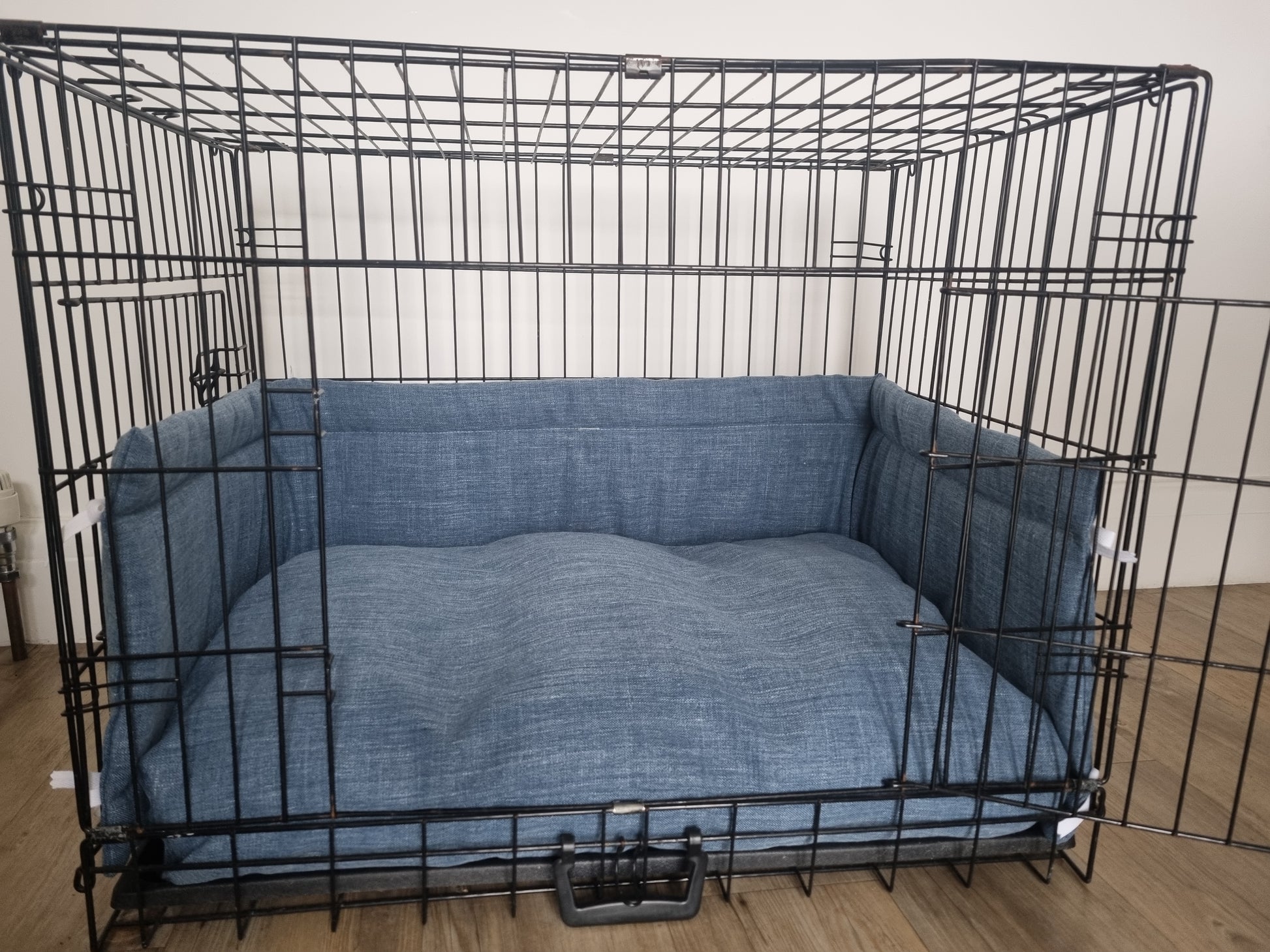 Dog crate bumper and bed - dog crate bedding. Blue textured design crate bumper pads attaching to metal dog crate to support with puppy training and dog crate training. 