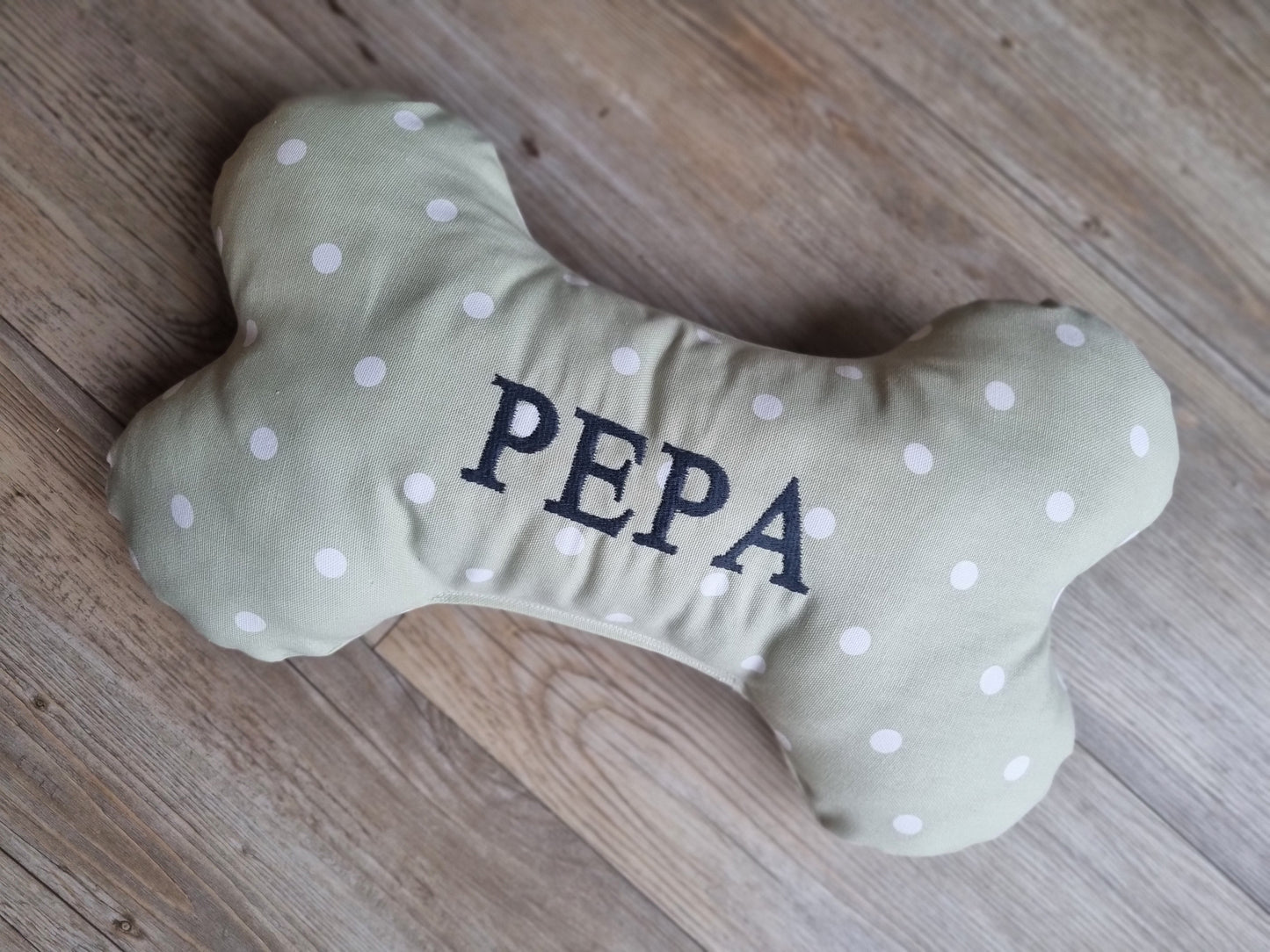 Personalised dog bone-shaped pillow. A neutral custom gift for dogs and puppies.