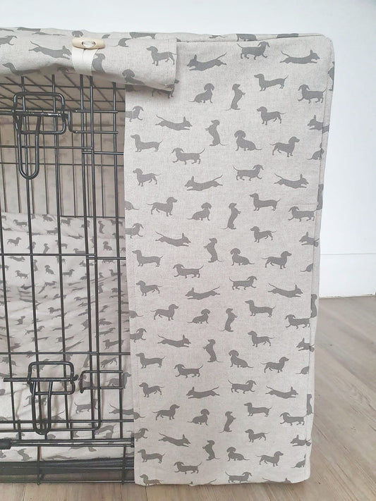 "A black wire dog crate covered with a custom fabric dog crate cover. An aesthetic kennel cover for dachshunds in a neutral dachshund design. 